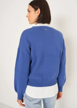 Cardigan Cross con ricamo frontale